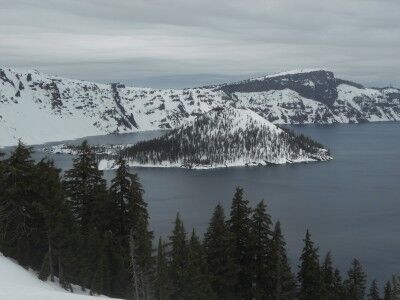 snow overed Crater Lake Wizzard Island in winter