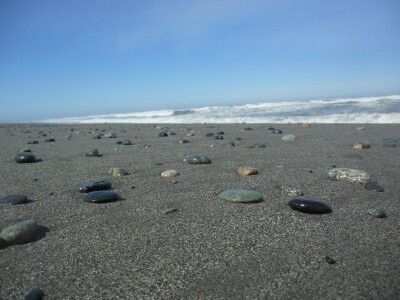 Rocks in sand at Gold Bluffs Beach in Redwoods National Park