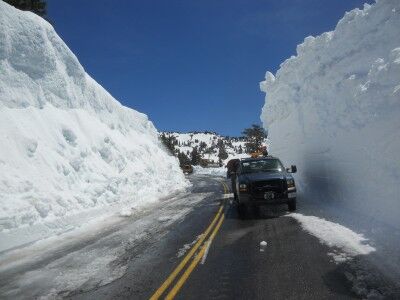 Truck next to snowbank at Lassen Volcanic National Park