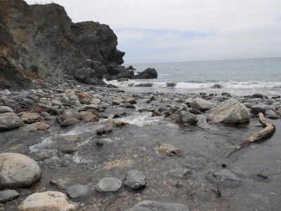 Limekiln Creek emptying into the ocean at Limekiln beach