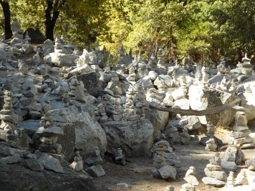 rock stacking mirror lake